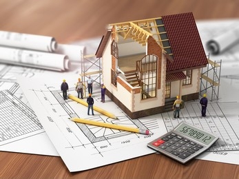 cross-section of a house model with floor plans, worker models and a calculator
